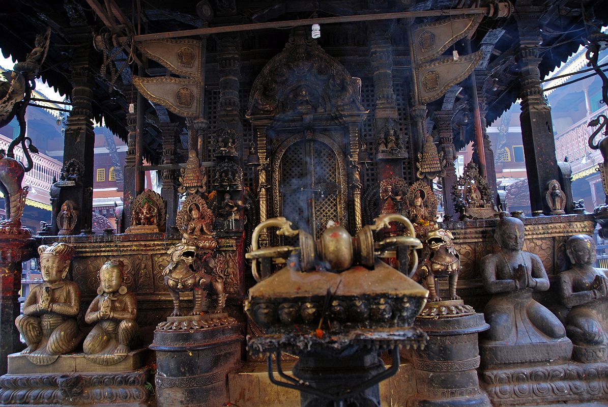 Kathmandu Patan Golden Temple 28 The Entrance Door To The Swayambhu Chaitya Is Guarded By Two Snow Lions And Has A Vajra And Many Statues Including The King And Queen 